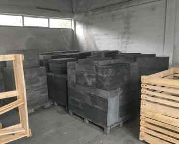 Porto VALONGO BLACK™ slate strips and tiles stacked in bulk for construction and landscaping use